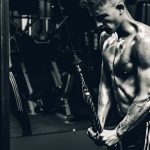 grayscale photo of man exercising